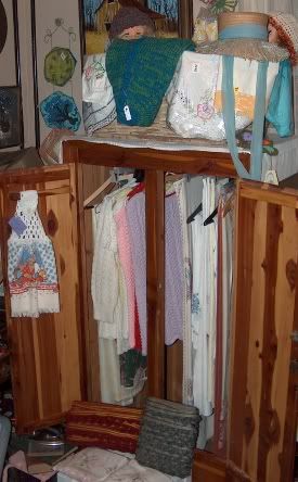 photo of Cedar Wardrobe showing some of the vintage clothing, linens and fabric for sale