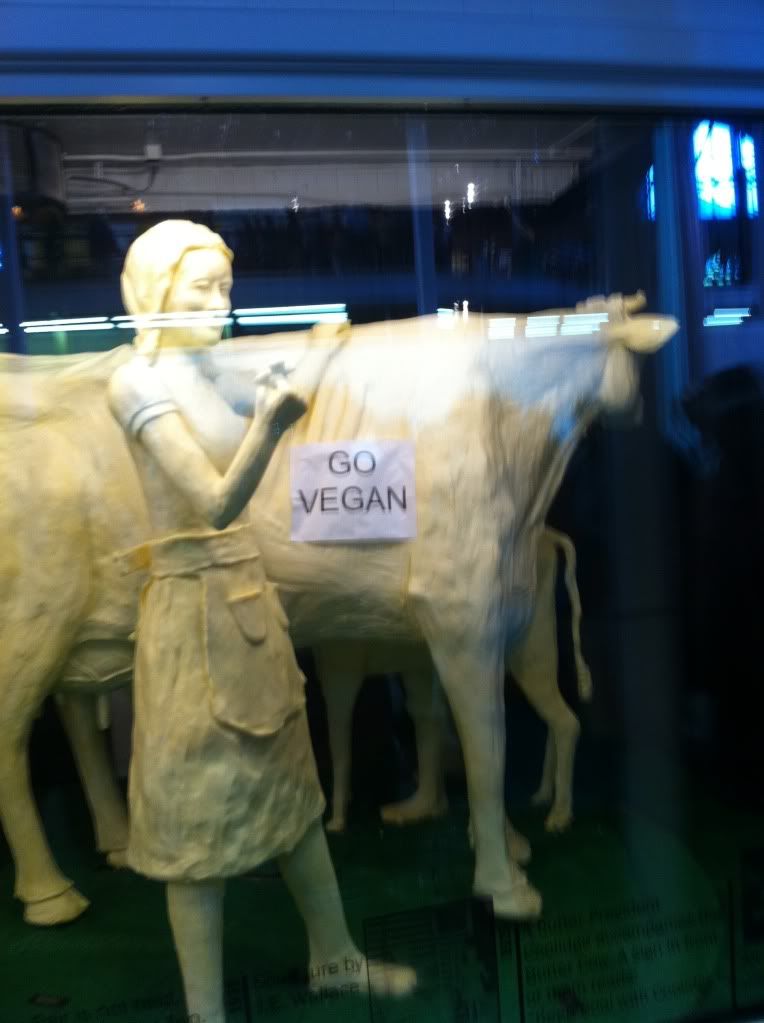 Go Vegan sign on Iowa State Fair Butter Cow