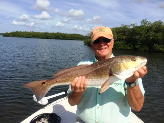 Don with one of four nice redfish for the day photo 012_zps3e2b2c20.jpg